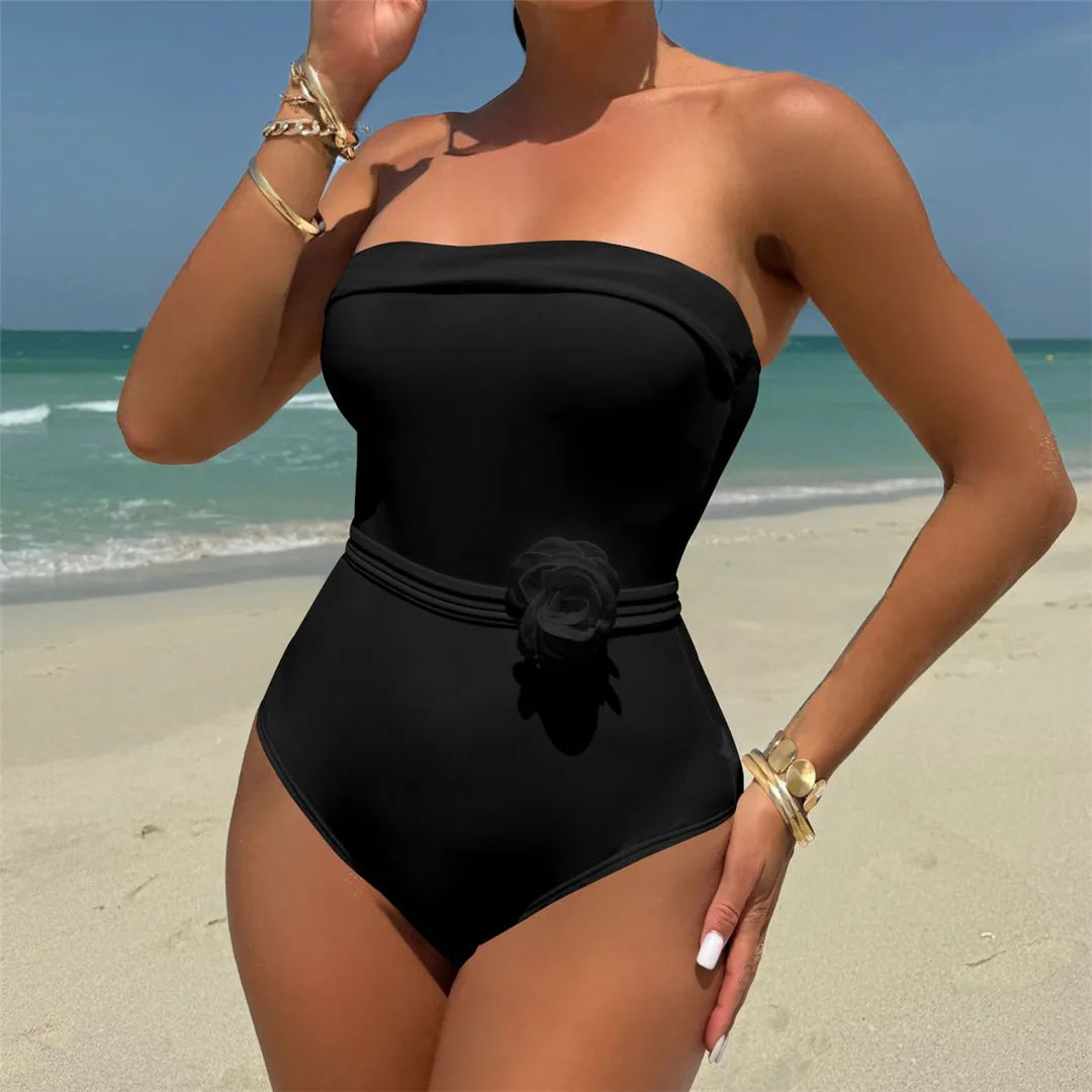 Strapless swimsuit with adjustable ties and flower